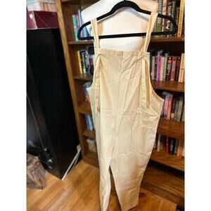 Khaki colored, linen-like overalls romper